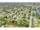 Aerial shot of a community, featuring lush greenery and waterway access, a desirable residential neighborhood at 3156 Depew Ave, Port Charlotte, FL 33952