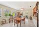 Inviting dining room with a classic dining set, natural light, and easy access to the outdoor patio at 3156 Depew Ave, Port Charlotte, FL 33952