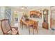 Dining room with a classic wooden table and easy access to the open kitchen, creating a welcoming space at 3156 Depew Ave, Port Charlotte, FL 33952