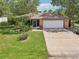Charming single-story home with a well-manicured lawn, landscaping, and a spacious driveway at 3156 Depew Ave, Port Charlotte, FL 33952