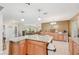 Open concept kitchen featuring granite countertops, an island with bar seating and seamless flow to the living area at 3156 Depew Ave, Port Charlotte, FL 33952