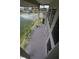 Expansive balcony space overlooking peaceful waterfront and lush greenery at 3402 Amberjack Dr, Hernando Beach, FL 34607