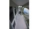 Spacious balcony overlooking waterfront views with white railings and tile flooring at 3402 Amberjack Dr, Hernando Beach, FL 34607