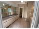 Spacious bathroom featuring double sinks, tile flooring, and a separate toilet room at 3402 Amberjack Dr, Hernando Beach, FL 34607