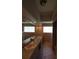 Bathroom with double sinks, tiled floors, a large mirror, and decorative glass block windows at 3402 Amberjack Dr, Hernando Beach, FL 34607