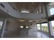 Spacious living room featuring a kitchen island, breakfast bar, tiled floors, and scenic waterfront views at 3402 Amberjack Dr, Hernando Beach, FL 34607