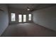 Main bedroom featuring a ceiling fan and access to a balcony with scenic views, perfect for relaxation at 3402 Amberjack Dr, Hernando Beach, FL 34607