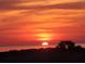Beautiful orange sunset over the ocean at 3402 Amberjack Dr, Hernando Beach, FL 34607