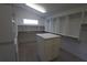 Large walk-in closet featuring ample shelving and storage with an island organizer at 3402 Amberjack Dr, Hernando Beach, FL 34607