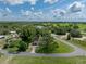 Aerial view of home showing surrounding landscape, mature trees, and expansive green spaces at 34819 Hibiscus Dr, Dade City, FL 33523