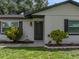 A close up shot showing the painted brick and new door of this well-maintained home at 34819 Hibiscus Dr, Dade City, FL 33523