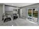 Modern kitchen features stainless steel appliances, granite counters, and access to the backyard at 34819 Hibiscus Dr, Dade City, FL 33523