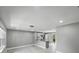 Open-concept living room featuring new flooring and recessed lighting at 34819 Hibiscus Dr, Dade City, FL 33523