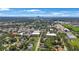 An aerial view of a cityscape showcasing lush green trees, homes, and the city skyline on the horizon at 3544 6Th S Ave, St Petersburg, FL 33711
