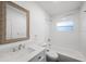 Well-lit bathroom features a vanity with quartz countertops, a modern commode, and shower-tub combination at 3544 6Th S Ave, St Petersburg, FL 33711