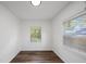 Bedroom featuring two windows for natural light and wood-look flooring at 3544 6Th S Ave, St Petersburg, FL 33711