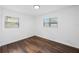 This bright bedroom features hardwood floors and two windows at 3544 6Th S Ave, St Petersburg, FL 33711