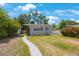 Charming home with a well-manicured front yard, complemented by a sidewalk leading to the front entrance at 3544 6Th S Ave, St Petersburg, FL 33711