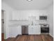 Bright modern kitchen with stainless appliances, white cabinets, and quartz counters at 3544 6Th S Ave, St Petersburg, FL 33711