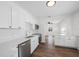 Bright kitchen features white cabinetry, modern appliances, and wood-look flooring at 3544 6Th S Ave, St Petersburg, FL 33711