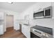 Modern kitchen featuring stainless steel appliances and white cabinets at 3544 6Th S Ave, St Petersburg, FL 33711