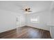 Open living room with natural light, ceiling fan, and wood-look flooring at 3544 6Th S Ave, St Petersburg, FL 33711