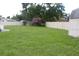 Spacious backyard with a white fence and storage shed at 38668 Ferm Cir, Zephyrhills, FL 33540