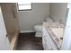 Bathroom featuring a white vanity, granite countertops, toilet and tiled walk-in shower at 38668 Ferm Cir, Zephyrhills, FL 33540