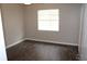Bright bedroom featuring a ceiling fan and a window that provides ample natural light at 38668 Ferm Cir, Zephyrhills, FL 33540