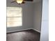 Bright bedroom featuring a ceiling fan and a window that provides ample natural light at 38668 Ferm Cir, Zephyrhills, FL 33540