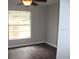 Bright bedroom featuring a ceiling fan and a window that provides ample natural light at 38668 Ferm Cir, Zephyrhills, FL 33540