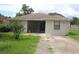 Charming single-story home with a well-maintained lawn and neutral-colored exterior at 38668 Ferm Cir, Zephyrhills, FL 33540