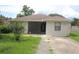 Charming single-story home with a well-maintained lawn and neutral-colored exterior at 38668 Ferm Cir, Zephyrhills, FL 33540