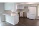 Modern kitchen with white cabinets, stylish countertops, and stainless steel refrigerator at 38668 Ferm Cir, Zephyrhills, FL 33540