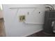 Laundry room featuring a water heater and shelving at 38668 Ferm Cir, Zephyrhills, FL 33540