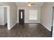 Open concept living room with hardwood floors and lots of natural light at 38668 Ferm Cir, Zephyrhills, FL 33540
