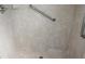 Accessible tile shower with grab bar and chrome fixtures at 38668 Ferm Cir, Zephyrhills, FL 33540