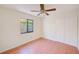 Light-filled bedroom with laminate floors and closet at 4008 Moreland Dr, Valrico, FL 33596