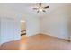 Spacious bedroom featuring light-colored walls, laminate flooring, and an ensuite bathroom at 4008 Moreland Dr, Valrico, FL 33596