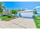 Charming single-Gathering home with a well-manicured lawn, driveway, and a two-car garage at 4008 Moreland Dr, Valrico, FL 33596