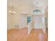 Spacious entryway with hardwood floors, elegant light fixtures, and a welcoming ambiance for guests at 4008 Moreland Dr, Valrico, FL 33596