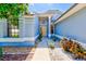 Inviting front entrance with a stylish blue exterior, a bright front door, and tasteful landscaping at 4008 Moreland Dr, Valrico, FL 33596