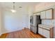 Bright kitchen with wood-look floors and stainless-steel refrigerator at 4008 Moreland Dr, Valrico, FL 33596