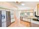 Well-lit kitchen featuring stainless steel appliances, ample counter space, and an efficient layout for cooking at 4008 Moreland Dr, Valrico, FL 33596