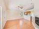 Open-concept living area with wood floors, fireplace, and eat-in kitchen at 4008 Moreland Dr, Valrico, FL 33596