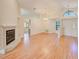 Bright living area with wood floors, fireplace, and an open view to the dining area at 4008 Moreland Dr, Valrico, FL 33596