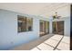 Covered patio featuring a ceiling fan, and sliding glass doors into the home at 4008 Moreland Dr, Valrico, FL 33596