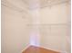 A bright walk-in closet with multiple levels of built-in white shelving at 4008 Moreland Dr, Valrico, FL 33596