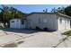 Charming single-story home with a well-maintained exterior, spacious driveway, and a light gray facade at 4802 Drift Tide Dr, New Port Richey, FL 34652
