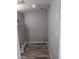 Functional utility room, featuring plank flooring, gray walls, and necessary plumbing fixtures at 4802 Drift Tide Dr, New Port Richey, FL 34652